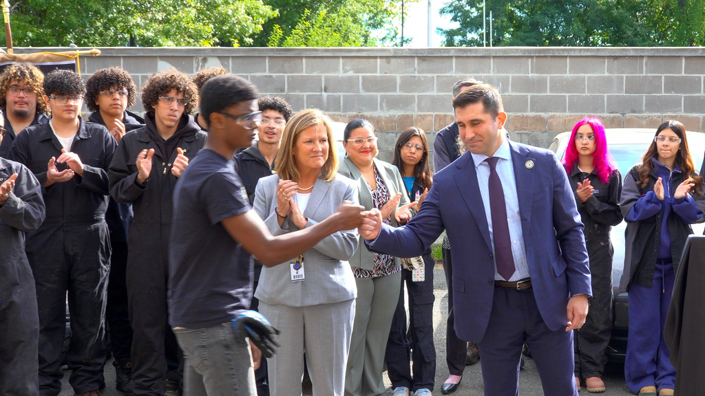 Fist bump with District Attorney and Dean Senior.