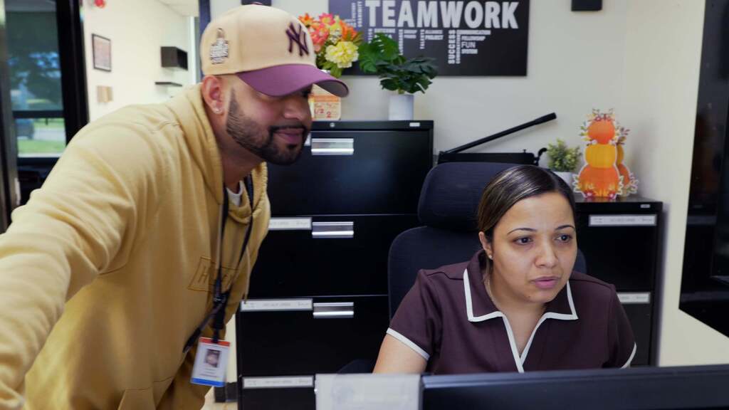 Alex talks with the front office at Sullivan