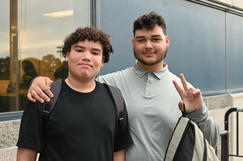 Two Dean students smile at camera