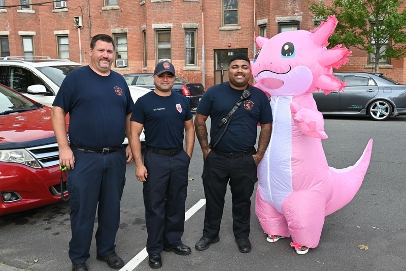The Holyoke Fire team and an axlotl smile for a photo