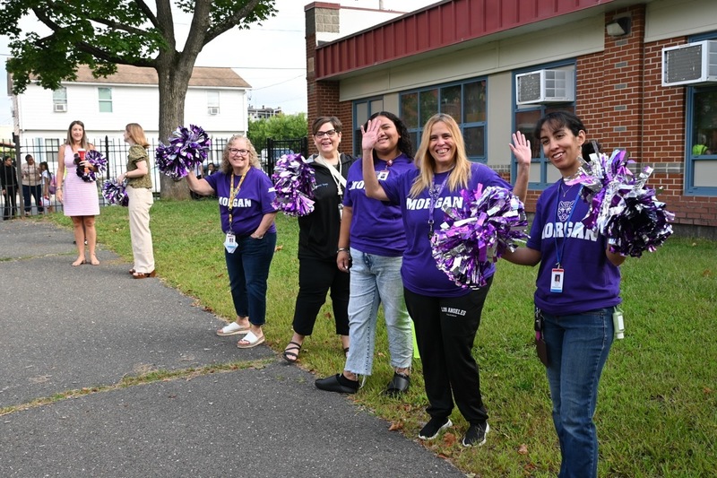 Morgan staff cheers with pompoms