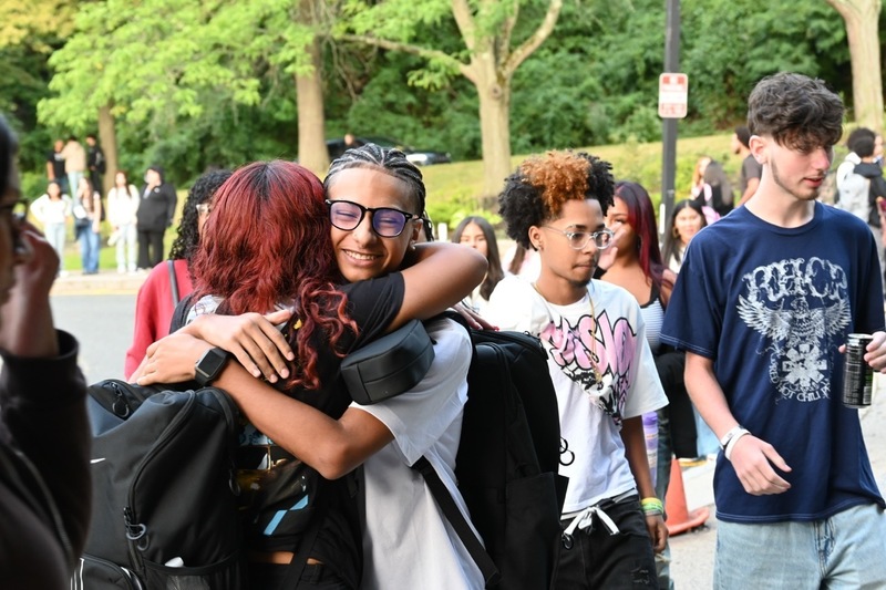 Students hug after returning to school