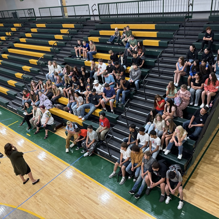 students get instruction while sitting in the bleachers. 