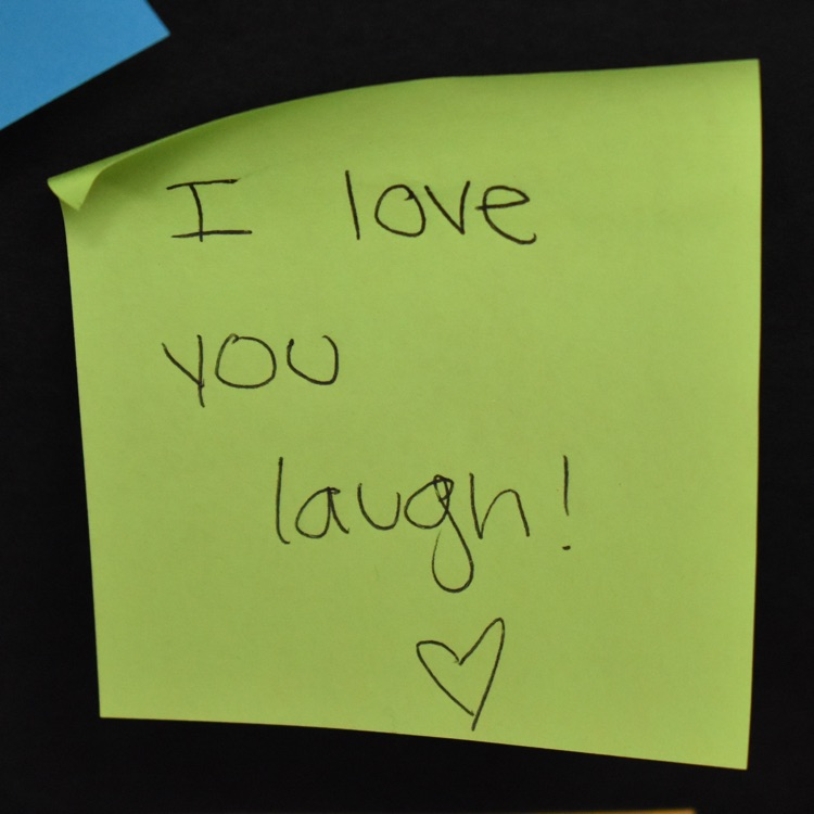 Sticky note that reads "i love your laugh" 