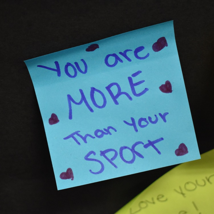 Sticky note that reads "you are more than your sport" 