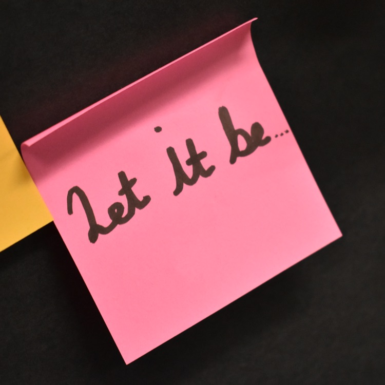 Sticky note that reads "let it be"