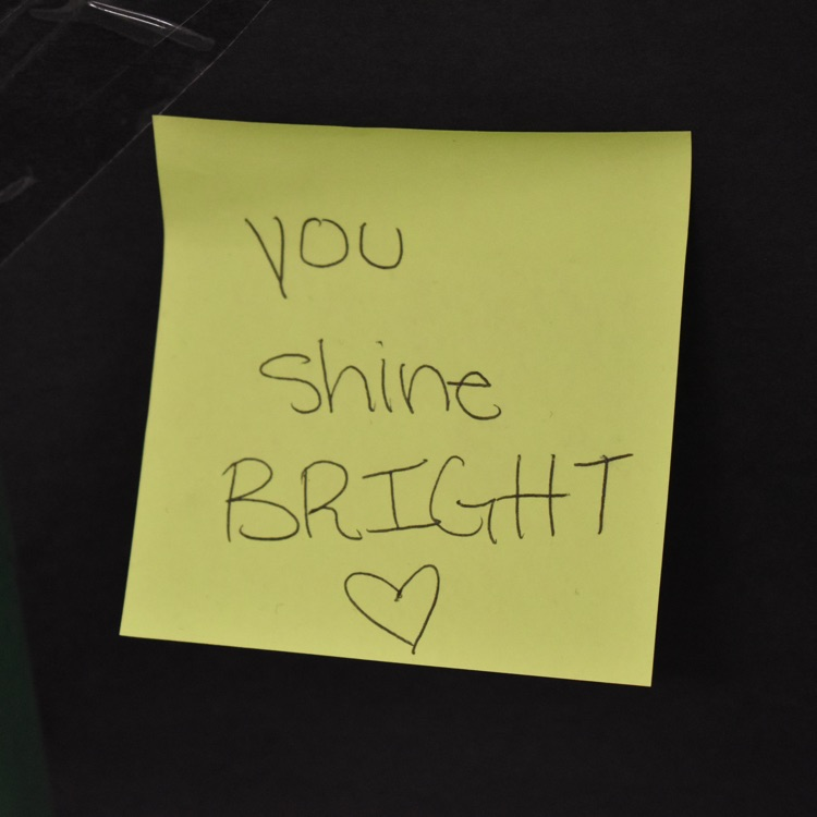 Sticky note that reads "you shine bright"