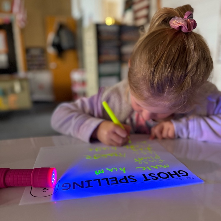 Girl writes on paper 