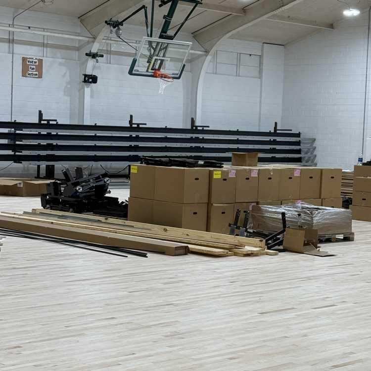 The new gym floor has been laid down. The new bleachers started going in today. 