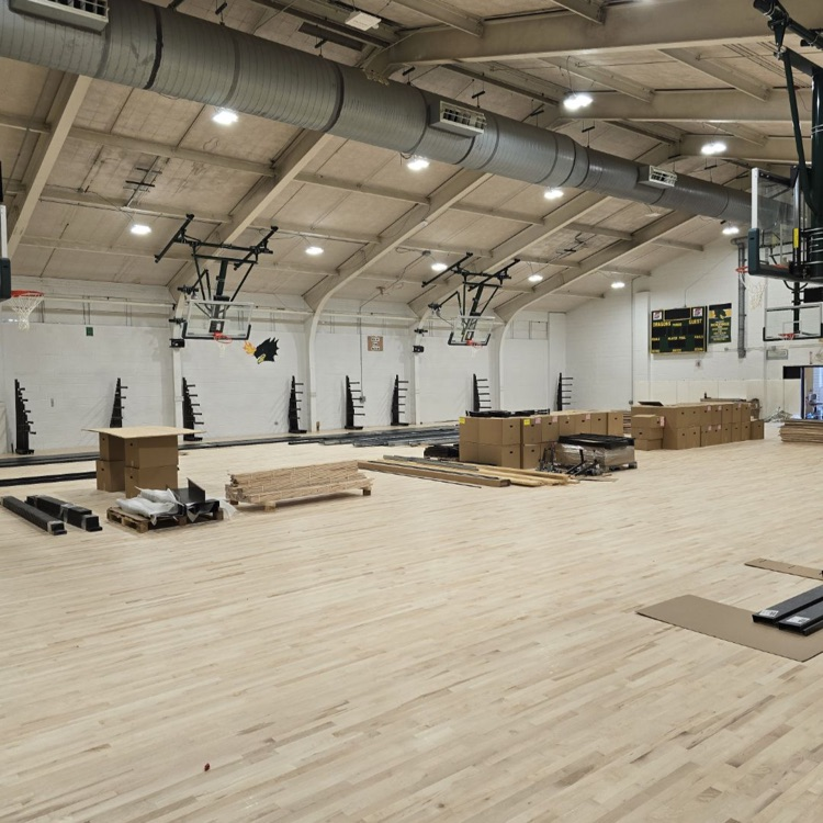 The new gym floor has been laid down. The new bleachers started going in today. 