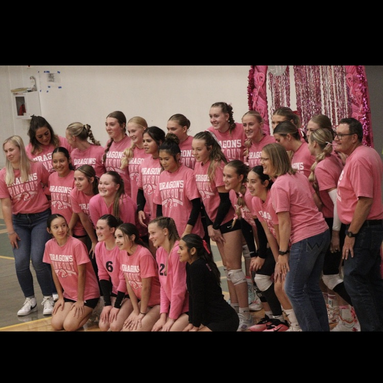 team standing together and smiling 