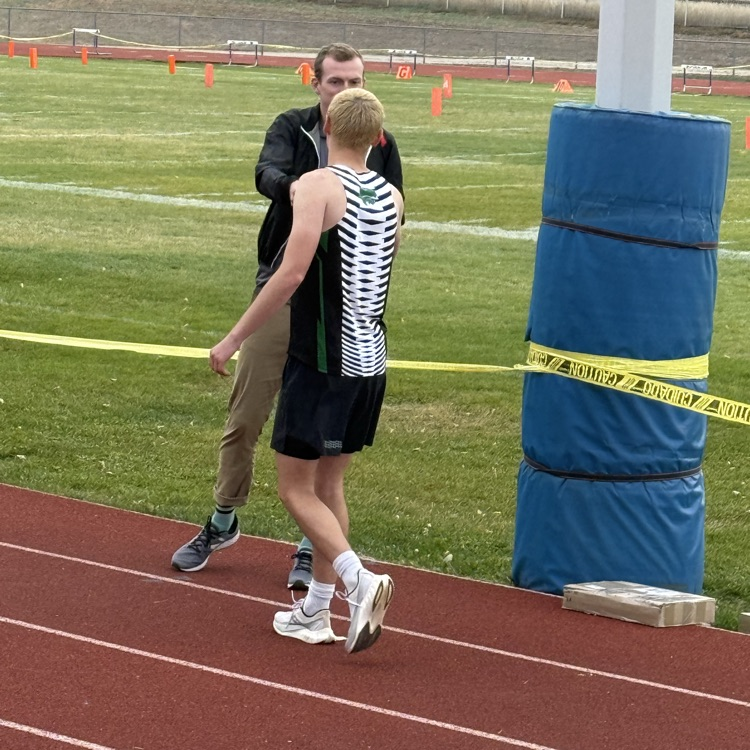 boy accepted a track medal 
