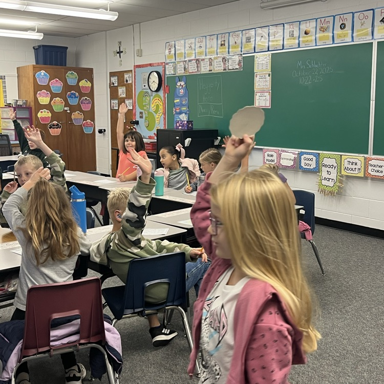 Girl shows class paper