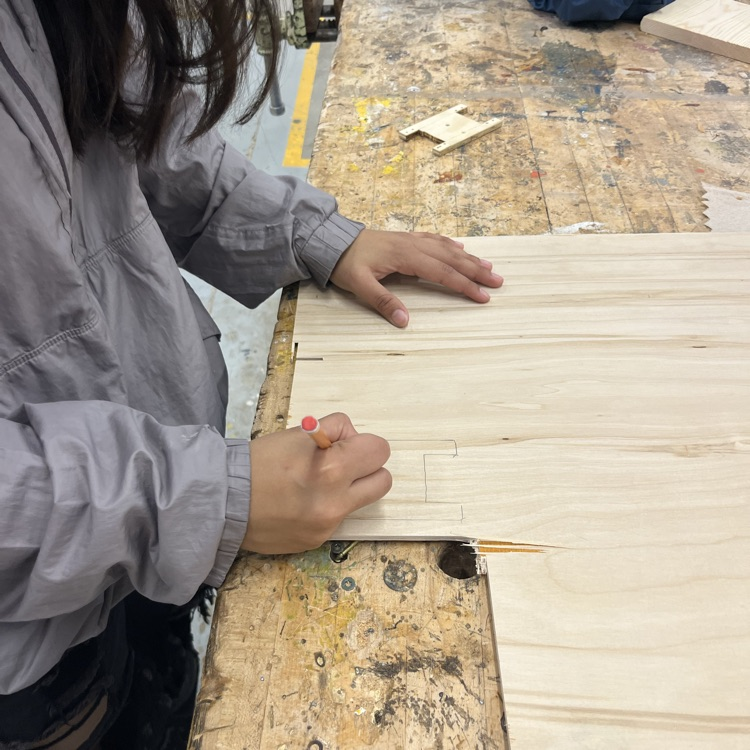 hands marking on wood