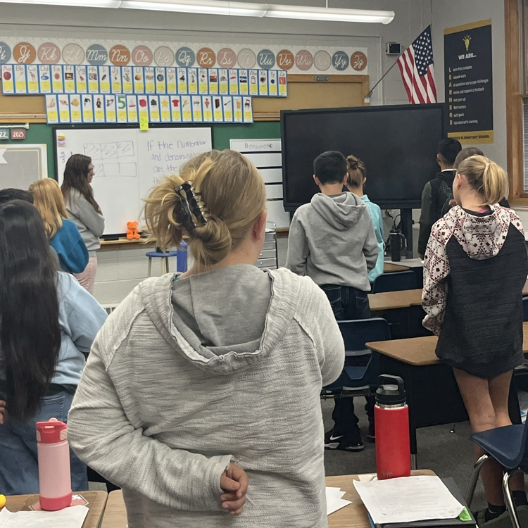 students face flag for pledge of allegiance 