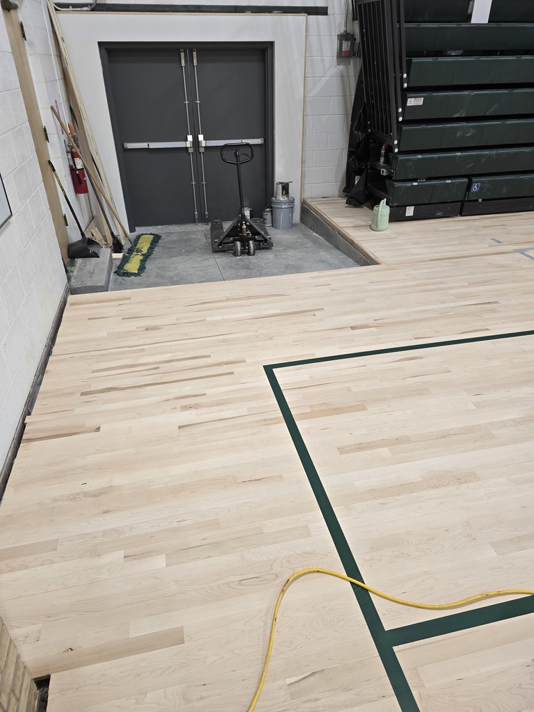Here are the most recent photos of the Old Gym Project. All of the lines have been painted, they are cleaning up today, and will put the first sealant coat on the entire floor on Thursday.  It will cure for a few days, and they will lightly sand the floor before they put the second coat of sealant on. The floor will cure a few days, they will sand it lightly again and place the last coat of sealant on the floor early next week.  The last sealant coat will cure for 10 to 12 days, and the gym should be ready for use around Dec. 1st.