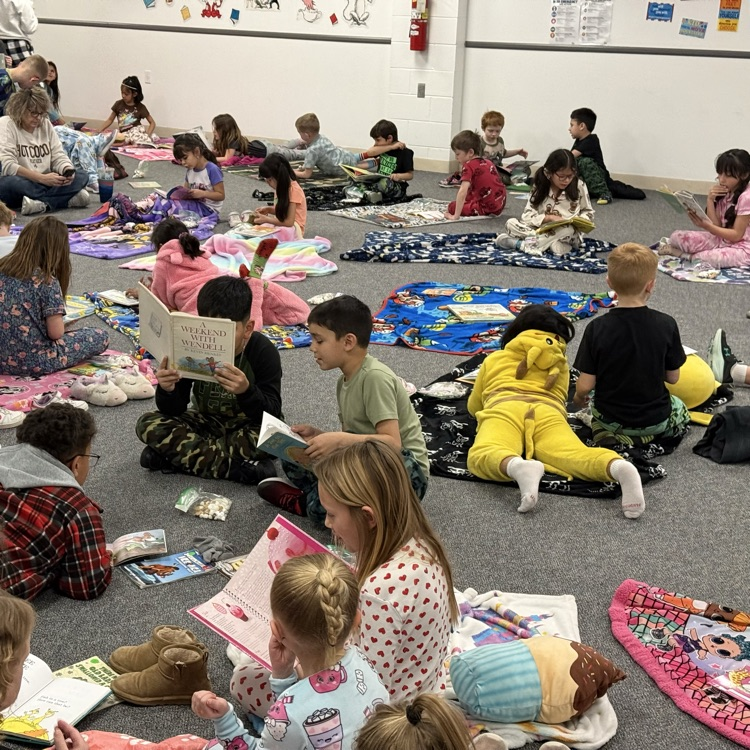 students reading in a large room