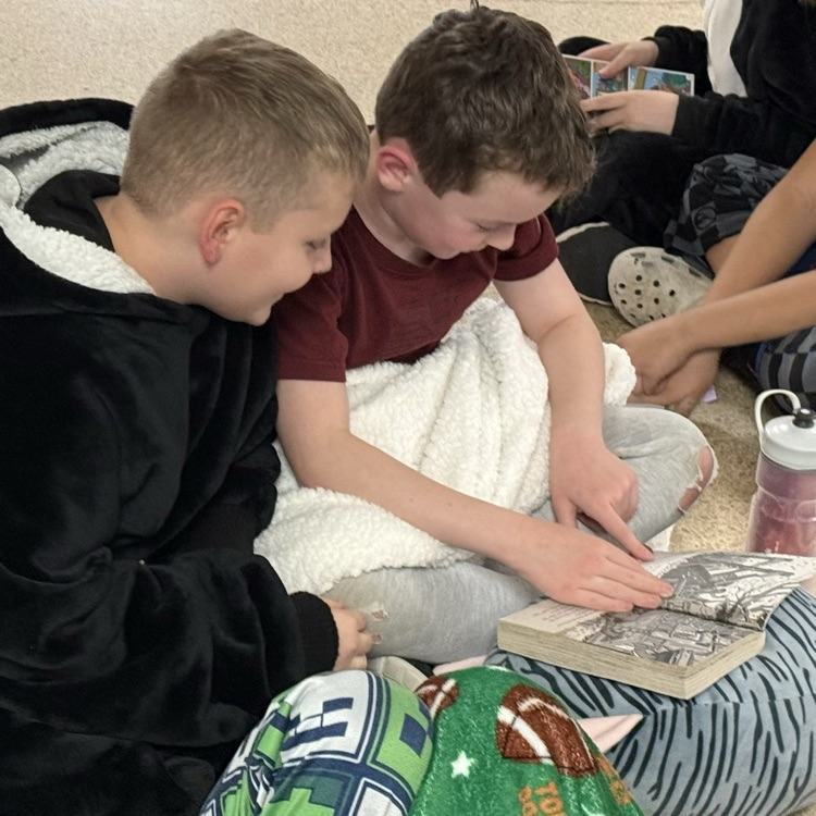 students reading in a hallway 