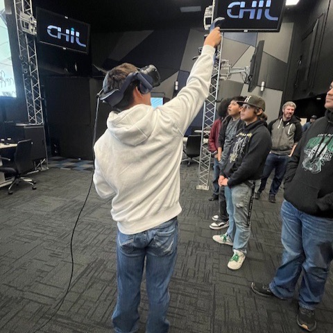 Students using VR headsets. 