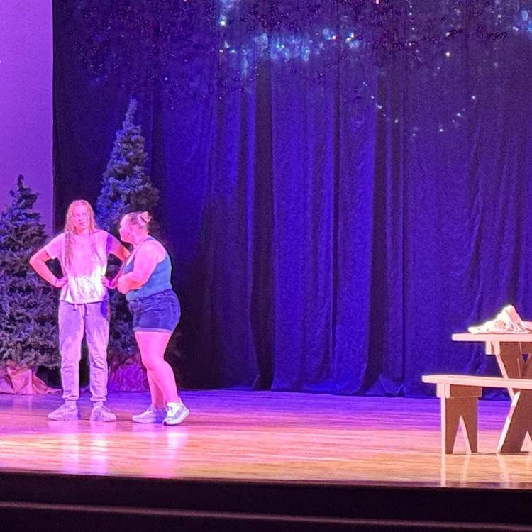 Students acting on stage.