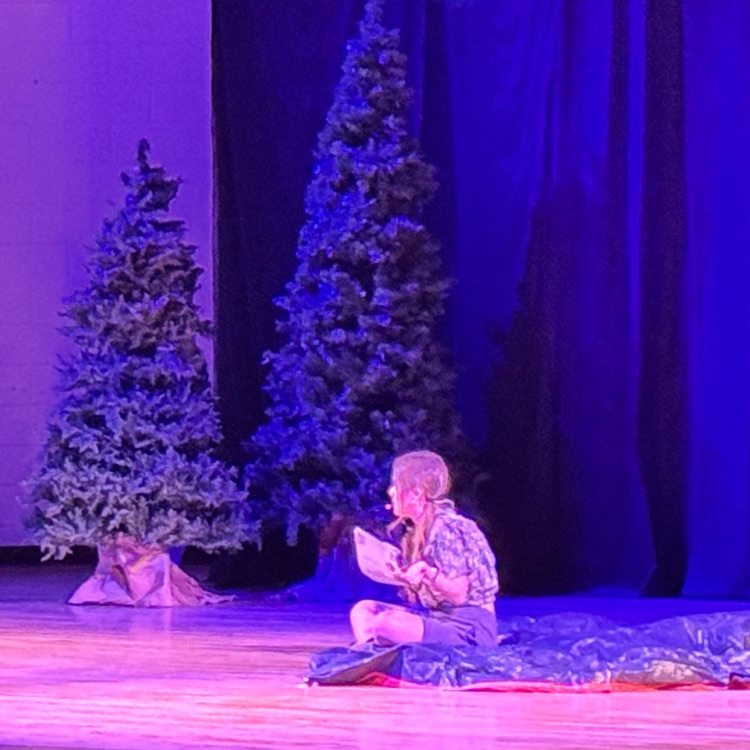  Students acting on stage.