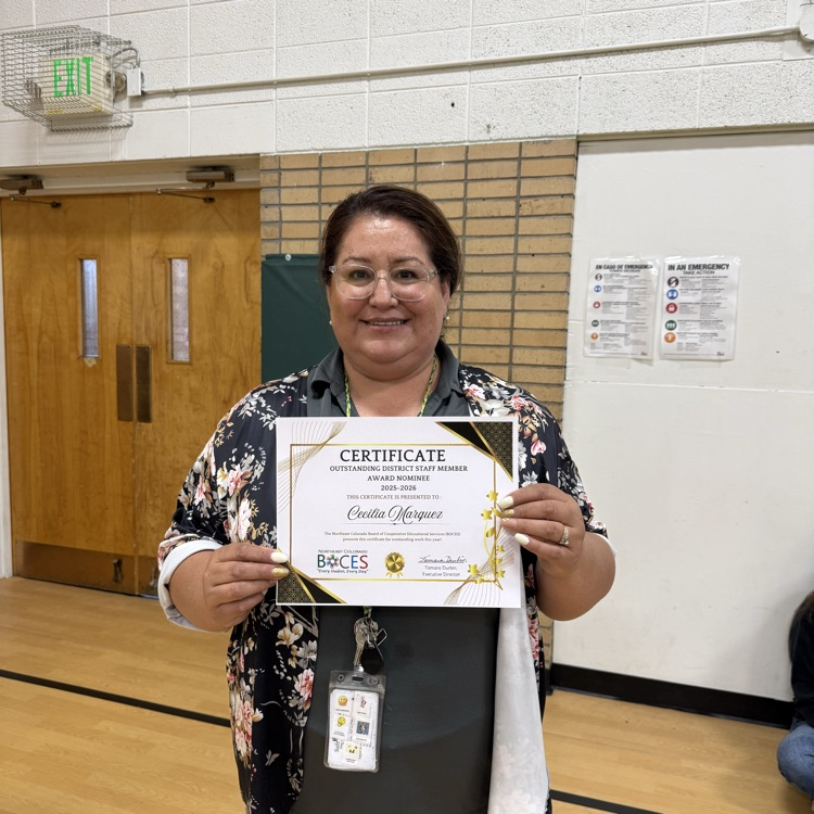 teacher holding a certificate