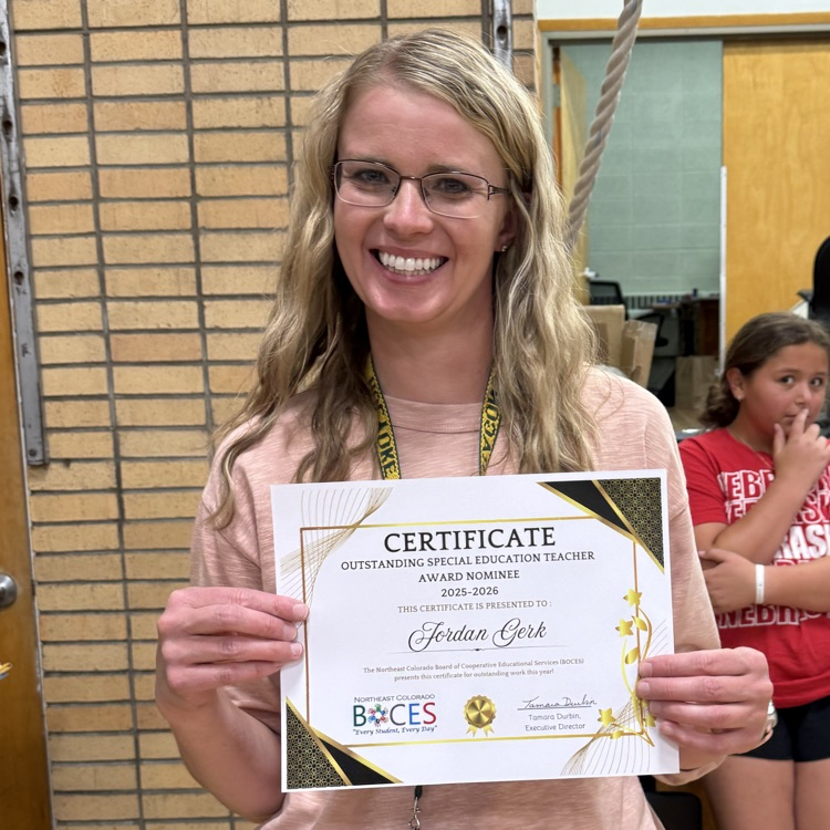 teacher holding a certificate