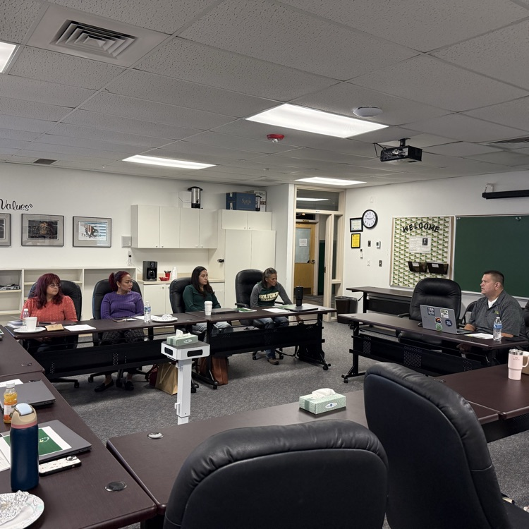 teachers meeting in a board room