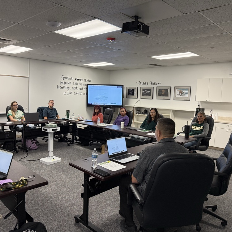 teachers meeting in a board room