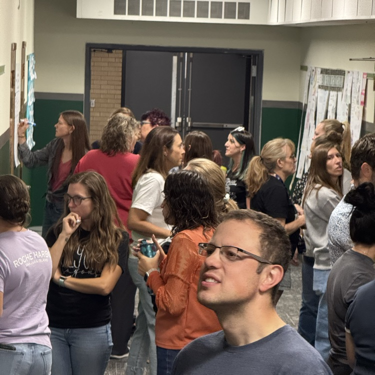 teachers participating in a gallery walk