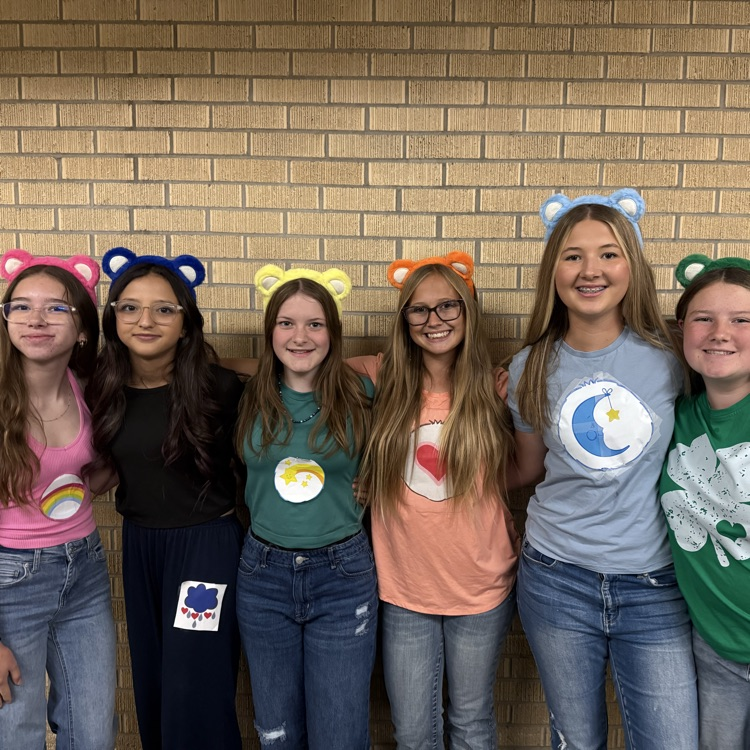 6 girls dressed as Care Bears