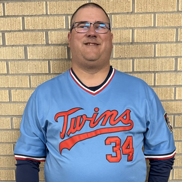 one man wearing a blue twins uniform
