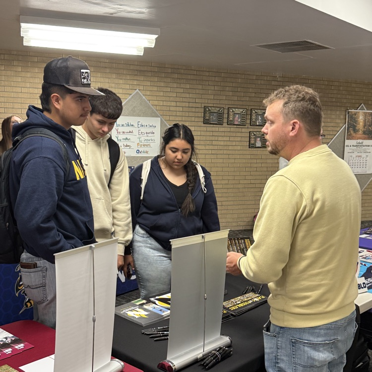 students visit with representatives from higher ed.