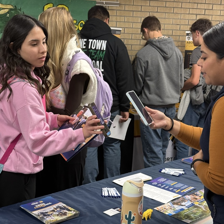 students visit with representatives from higher ed.