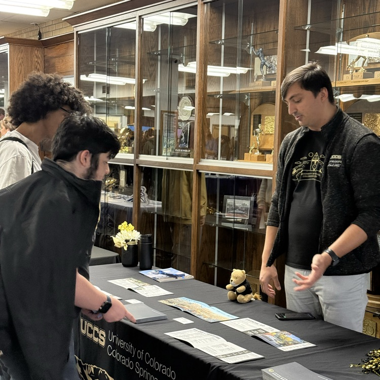 students visit with representatives from higher ed