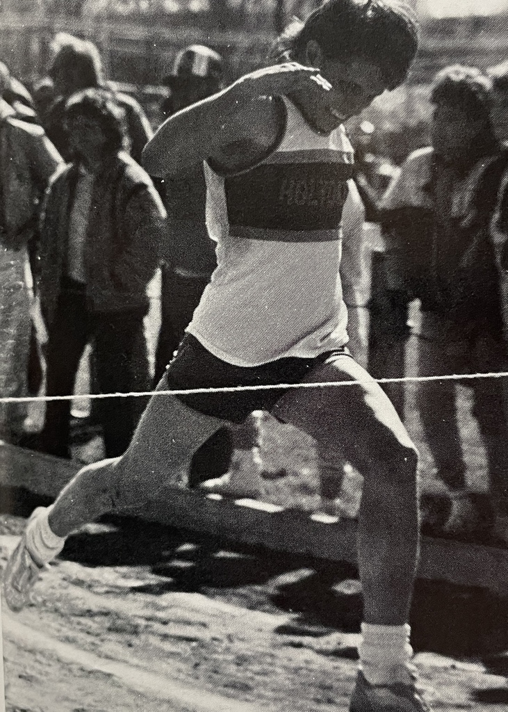 Track finisher runs across a tape.