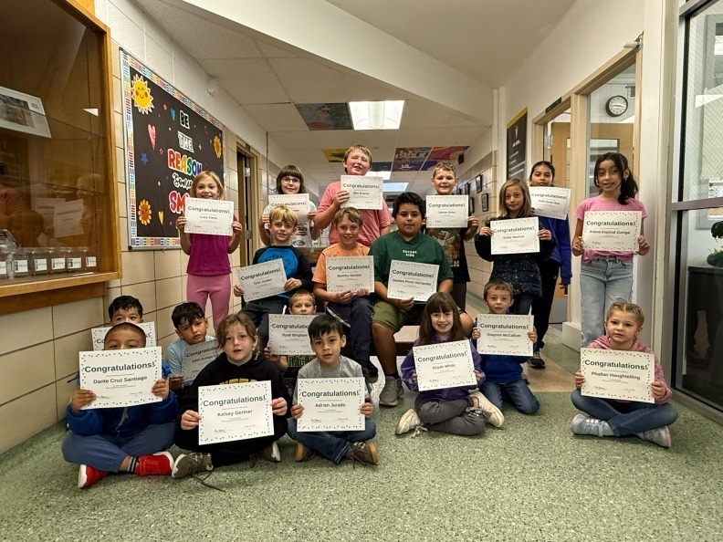 Student holding a certificate