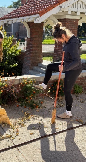 student sweeping