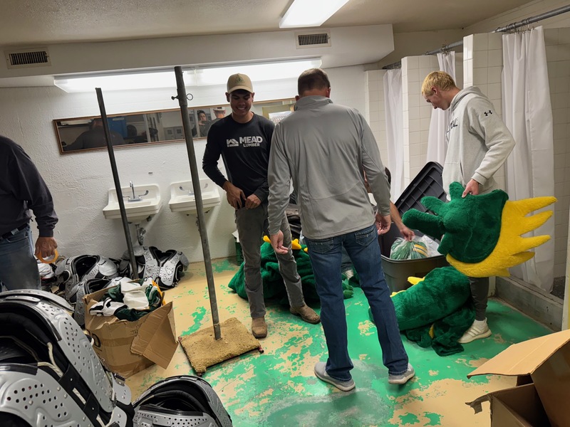students sorting what is needed in the storage areas