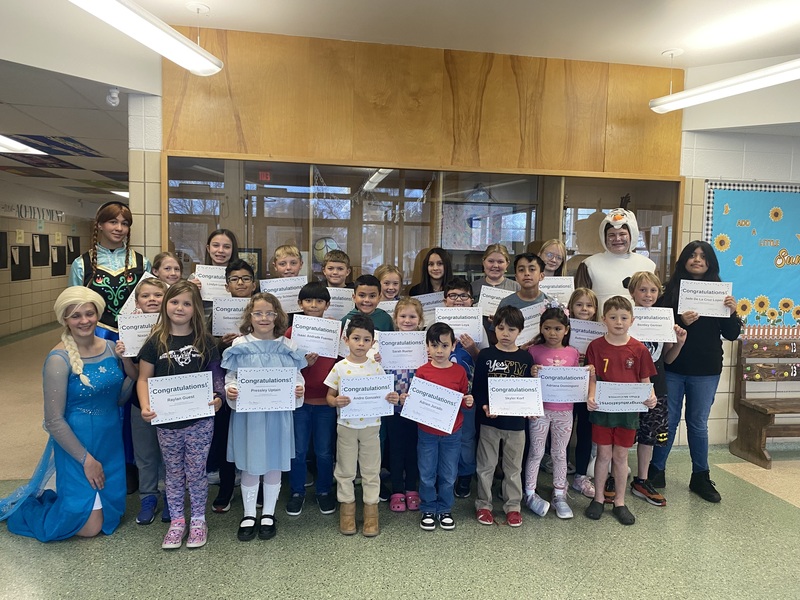 Students holding a certificate