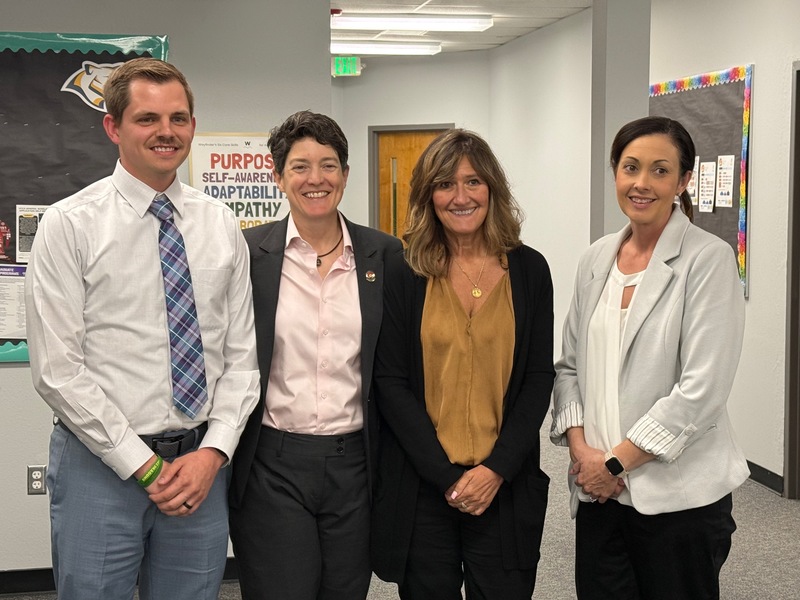 3 Holyoke staff members pose for a picture with the Colorado Chief Justice