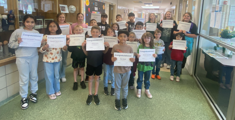 Students holding certificates