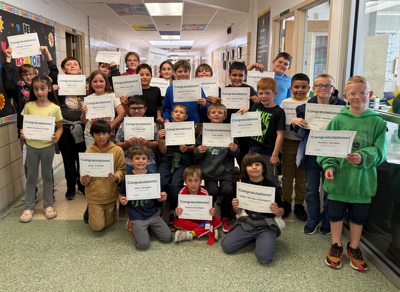 Students holding certificates