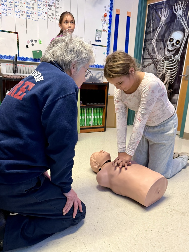 students learning CPR