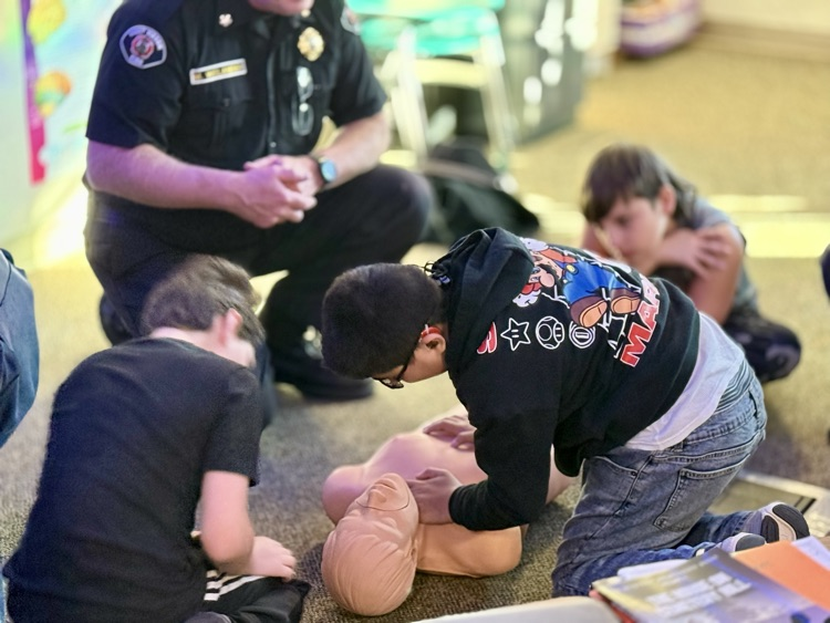 students learning CPR