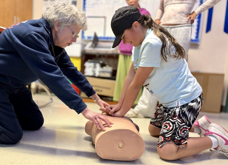 students learning CPR