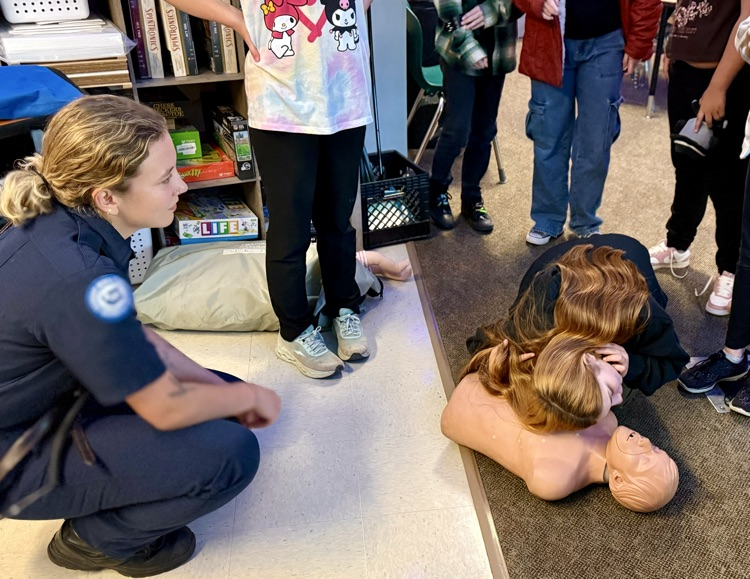 students learning CPR