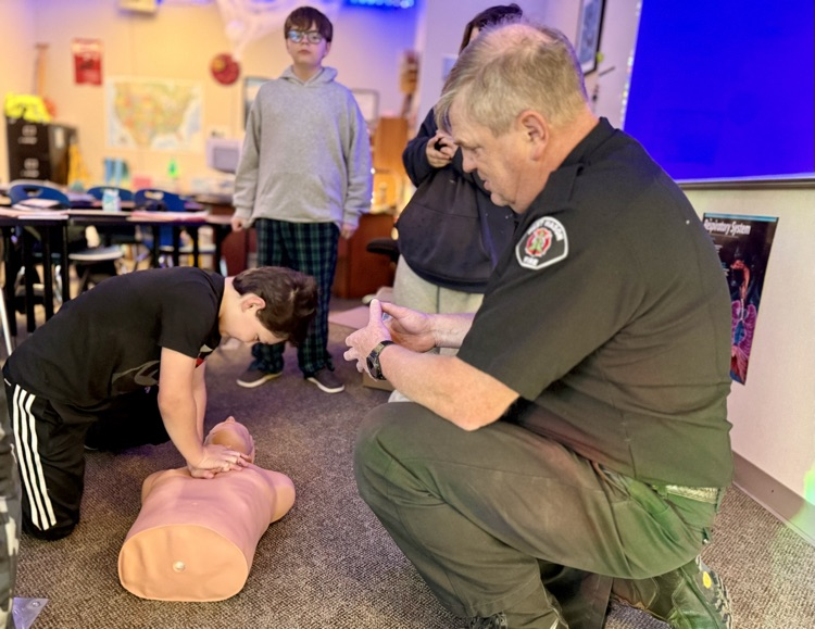 students learning CPR