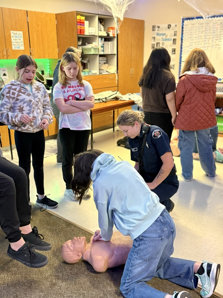 students learning CPR