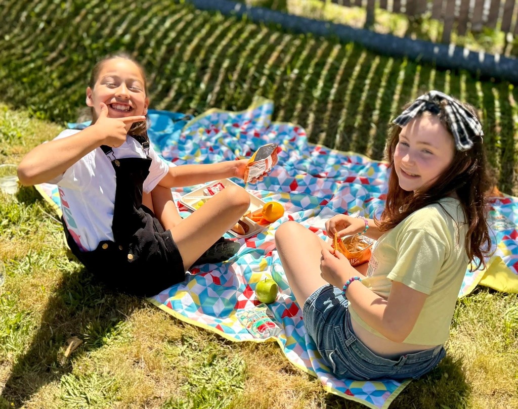Students enjoying lunch outside.